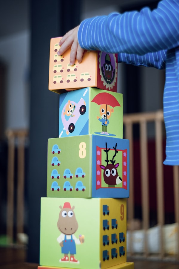 Child stacking colorful educational blocks